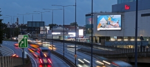  Digital billboard displaying school open evening advertisement in town centre UK