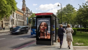 Digital Adshel Live bus shelter screen displaying school open evening advertisement UK